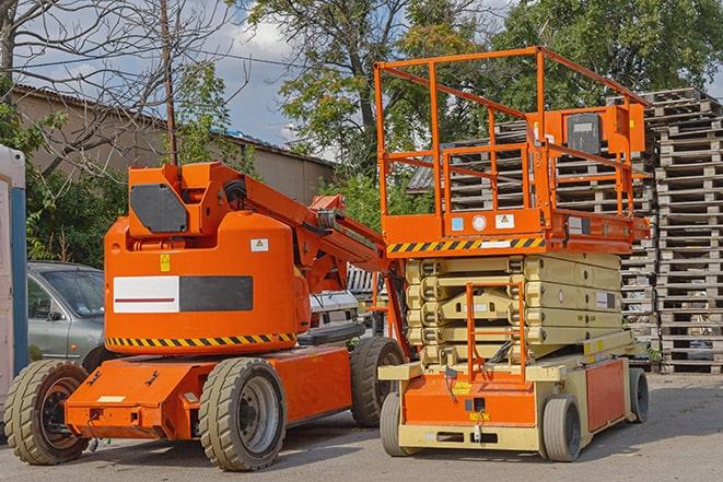 warehouse forklift in action during a busy workday in Lansing